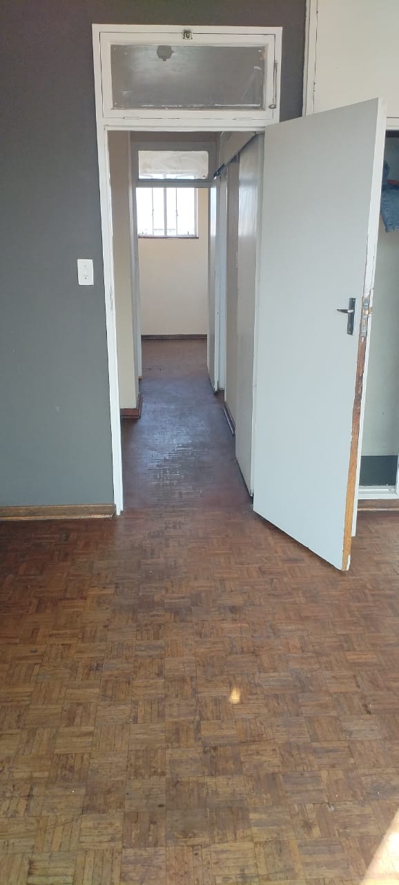 Renovated hallway with restored parquet floors