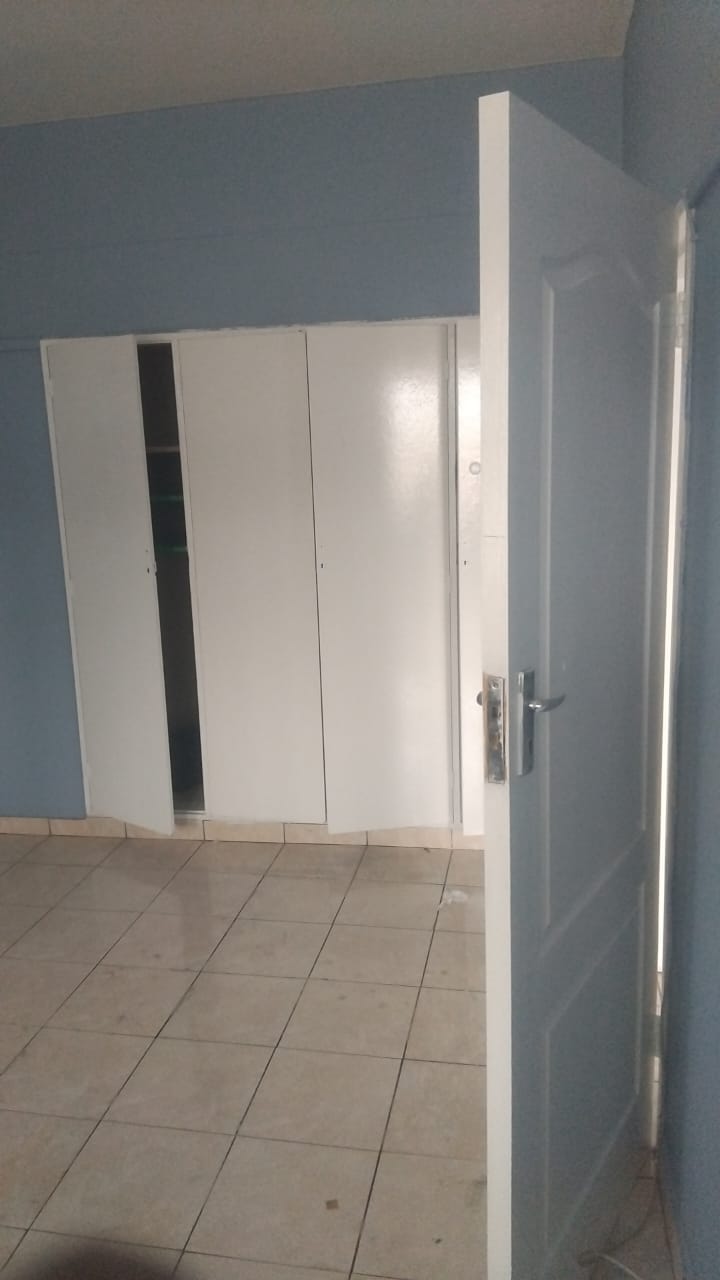Original built-in cupboards before refurbishment