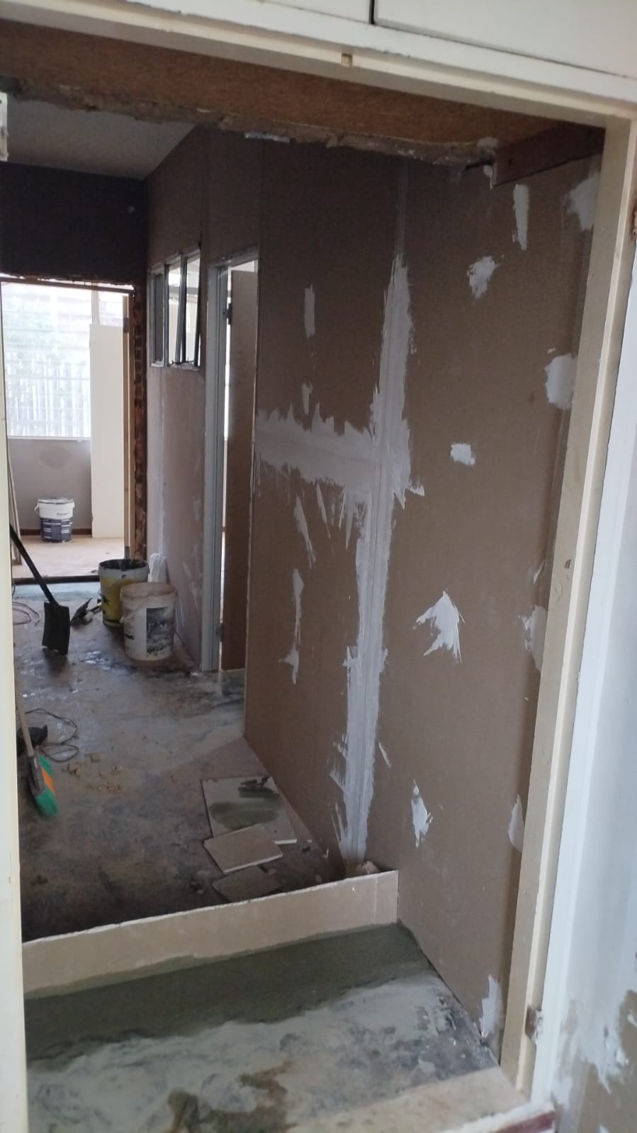 Plastering and wall preparation in progress