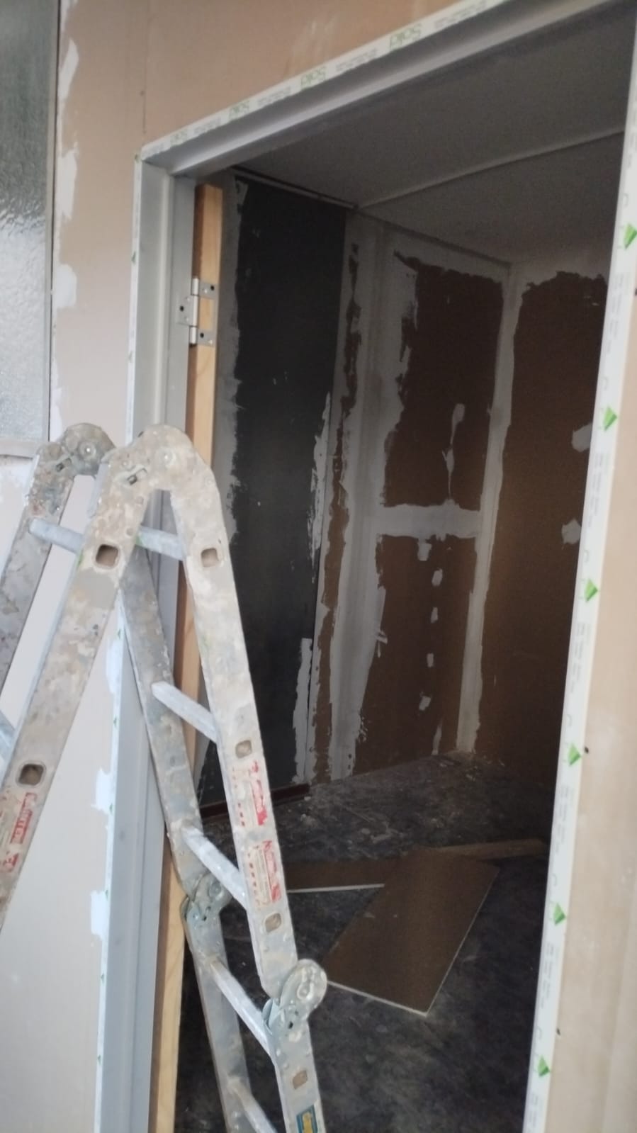 New door frame fitted, walls being prepped