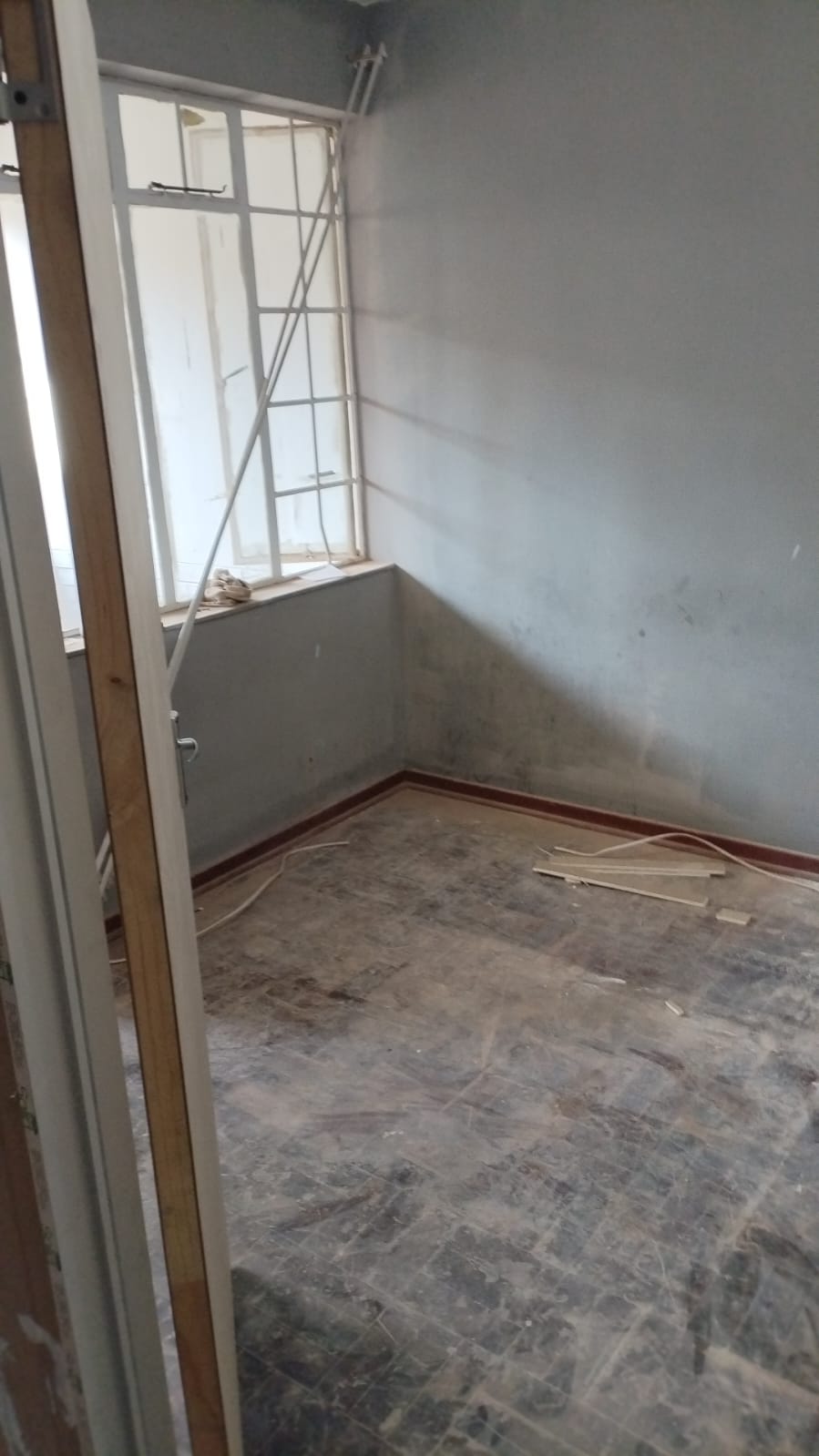 Empty dilapidated room prior to refurbishment